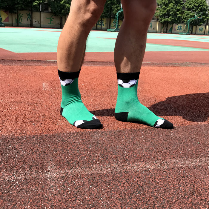 Green football patterned athletic crew socks for men