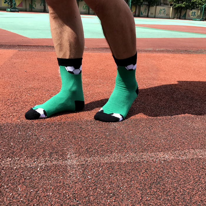 Green football patterned athletic crew socks for men